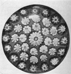 Sandwich Copied Clichy: The millefiori canes, some with rose centers, and their arrangement bespeaks design of the Clichy factory but the glass, especially casing, is distinctly Sandwich origin. Sandwich Copied Clichy: The millefiori canes, some with rose centers, and their arrangement bespeaks design of the Clichy factory but the glass, especially casing, is distinctly Sandwich origin.