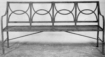 A Sheraton Garden Bench in Wrought Iron: The lines and design in this piece were clearly inspired by those of the sofas by Thomas Sheraton. A Sheraton Garden Bench in Wrought Iron: The lines and design in this piece were clearly inspired by those of the sofas by Thomas Sheraton.