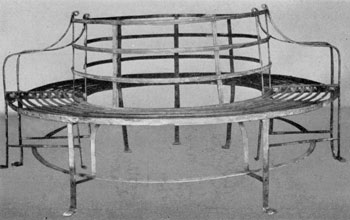 An 18th-Century Tree Seat: It was made in two parts to surround the trunk. This is a piece that was developed in England. The decoration was achieved by reeding and the use of well-shaped paw feet. An 18th-Century Tree Seat: It was made in two parts to surround the trunk. This is a piece that was developed in England. The decoration was achieved by reeding and the use of well-shaped paw feet.