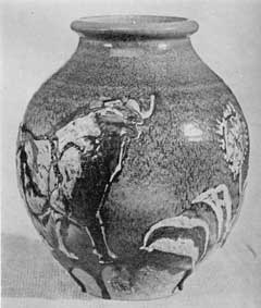 Illustration V: Vase with Drip Glaze: Made by John Dee Wareham, it has a rugged turquoise dry glaze applied to a terra cotta body. The design shows a bull and some trees. About 1915 Rookwood ceased to make many pieces of terra cotta body. Illustration V: Vase with Drip Glaze: Made by John Dee Wareham, it has a rugged turquoise dry glaze applied to a terra cotta body. The design shows a bull and some trees. About 1915 Rookwood ceased to make many pieces of terra cotta body.