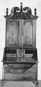 Walnut Secretary Made by Jacob Bachman Between 1766 and 1770: All of the carving, treatment of the bonnet top, and desk interior are characteristic of his work. The folio drawers on either side of central closet of the interior have boldly carved pilaster fronts and are wooden pegged instead of being dove-tailed together. In the base, dust boards separate each drawer space, which is considered unusual in American furniture. Walnut Secretary Made by Jacob Bachman Between 1766 and 1770: All of the carving, treatment of the bonnet top, and desk interior are characteristic of his work. The folio drawers on either side of central closet of the interior have boldly carved pilaster fronts and are wooden pegged instead of being dove-tailed together. In the base, dust boards separate each drawer space, which is considered unusual in American furniture.