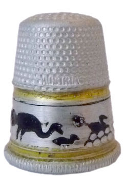 Settmacher. Made of aluminium with a band showing ostriches in black. 'Austria' is lettered into the indentations. From the 1920s Settmacher. Made of aluminium with a band showing ostriches in black. 'Austria' is lettered into the indentations. From the 1920s