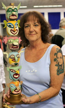 A guest shows us her ceramic totem pole while waiting for an appraiser. Although only one side is pictured, the totem features unique and colorful faces on both sides. A guest shows us her ceramic totem pole while waiting for an appraiser. Although only one side is pictured, the totem features unique and colorful faces on both sides.