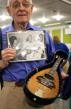 Carmine and his Vinaccia mandolin from Naples, Italy, bought by his father 101 years ago. Carmine and his Vinaccia mandolin from Naples, Italy bought by his father 101 years ago.