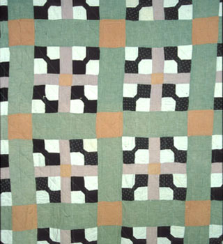 Cynthia Hartsel Hurst and Nan Hurst worked together on this early 20th-century quilt, which they called "Gentleman's Bow." TennesseeTSLA-a0a0o0-a_7865