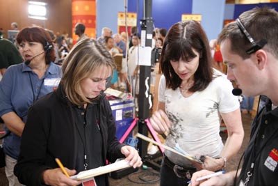 During a recent taping, Bemko compared notes with associate producer Jill Giles (left). caption here