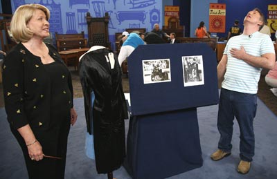 On the set in Palm Springs, California, the crew gets ready for a segment. The black dress in the center was worn by Marilyn Monroe—photos to the left of the dress show it in action. caption here