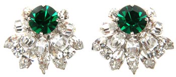 Christian Dior is one of many mainstream fashion designers who created costume jewelry for their customers. These earrings from around 1970 feature diamante and faux emerald rhinestones. Christian Dior is one of many mainstream fashion designers who created costume jewelry for their customers. These earrings from around 1970 feature diamante and faux emerald rhinestones.