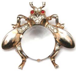 Many Trifari Jelly Bellies from the 1950s were relatively simple, such as this fly brooch made of sterling vermeil, diamante accents, and red cabochon eyes. Many Trifari Jelly Bellies from the 1950s were relatively simple, such as this fly brooch made of sterling vermeil, diamante accents, and red cabochon eyes.