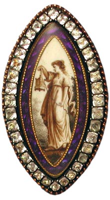 The woman in this brooch with paste edging is holding a lantern, as if to light the way for one's encounter with one's maker. The woman in this brooch with paste edging is holding a lantern, as if to light the way for one's encounter with one's maker.