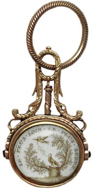 In this French watch fob, a husband's dedication to his late wife reads, "the further apart, the tighter the bond." In this French watch fob, a husband's dedication to his late wife reads, "the further apart, the tighter the bond."