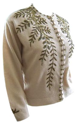 This angora sweater made by Peacock Sweaters in the early 1960s has a '50s feel to it thanks to the beaded-vine pattern and beaded sewn-closed buttonholes.