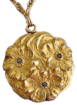 Lockets were also in demand during the Art Nouveau period. This gold-filled example has embossed flowers and rhinestones. Lockets were also in demand during the Art Nouveau period. This gold-filled example has embossed flowers and rhinestones.