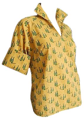 Novelty prints were very popular in the 1950s. This foldover-collar blouse features bowling pins with the numbers 1, 3, 5 or 6 on them.