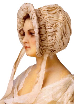 Known as a Jane Austen bonnet, this circa 1812 piece is made of raw silk draped and shirred over a wire frame. Known as a Jane Austen bonnet, this circa 1812 piece is made of raw silk draped and shirred over a wire frame.