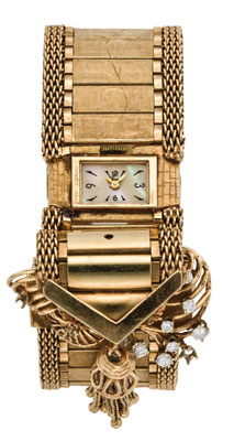 This Croton from the 1940s is almost all 14K yellow-gold band, plus the diamonds and mother-of-pearl dial. Croton