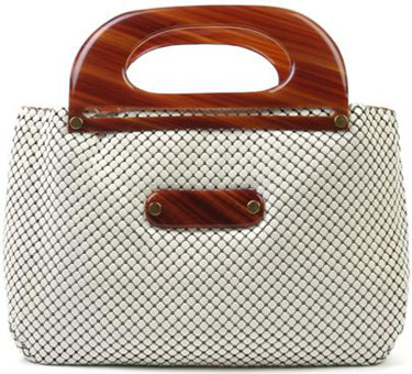 Whiting and Davis was a big name for purses in the 1920s. This white mesh number has tortoise resin handles and two interior pockets. A Whiting and Davis White Mesh Purse, with tortoise resin handles, two interior pockets. Labeled: Whiting and Davis Co./Mesh Bags/Made in U.S.A.