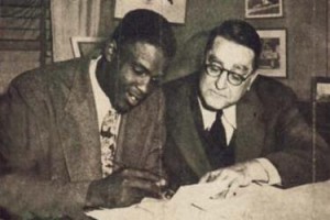 On October 23, 1945, Dodgers President Branch Rickey signed Jackie Roosevelt Robinson to the Brooklyn Dodgers, breaking major-league baseball's color barrier.