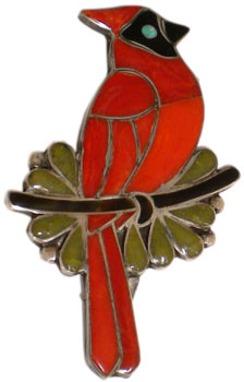 This coral, turquoise, jet, and serpentine cardinal pin was made in the late 1960s or early 1970s by the late Zuni artist Porfilio Sheyka. This coral, turquoise, jet, and serpentine cardinal pin was made in the late 1960s or early 1970s by the late Zuni artist Porfilio Sheyka.