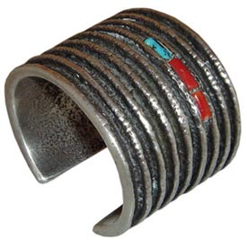 Hopi artist Charles Loloma (1921-1991) is arguably the most famous of all Indian jewelry makers. This cast bracelet has turquoise and coral accents. Hopi artist Charles Loloma (1921-1991) is arguably the most famous of all Indian jewelry makers. This cast bracelet has turquoise and coral accents.