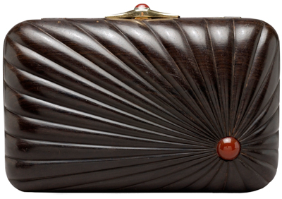 Though her factory was in New York, Leiber shopped the globe for the best materials and artisans. For example, this ebony box from 1981 was carved in India but features Italian hardware. Cornelians accent the lock and side of the box. Though her factory was in New York, Leiber shopped the globe for the best materials and artisans. For example, this ebony box from 1981 was carved in India but features Italian hardware. Cornelians accent the lock and side of the box.