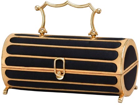 Sometimes the line between box and bag blurs, as in this gold-handled Florentined cylinder, with inlaid black satin, from 1968. Sometimes the line between box and bag blurs, as in this gold-handled Florentined cylinder, with inlaid black satin, from 1968.