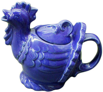 The designer of this Blue Rooster teapot is uncertain, but it may have been Belle Kogan. The teapot was introduced in 1944 but was dropped from production, along with most other Gypsy Trail Hostess Ware items, around the end of World War II. The designer of this Blue Rooster teapot is uncertain, but it may have been Belle Kogan. The teapot was introduced in 1944 but was dropped from production, along with most other Gypsy Trail Hostess Ware items, around the end of World War II.