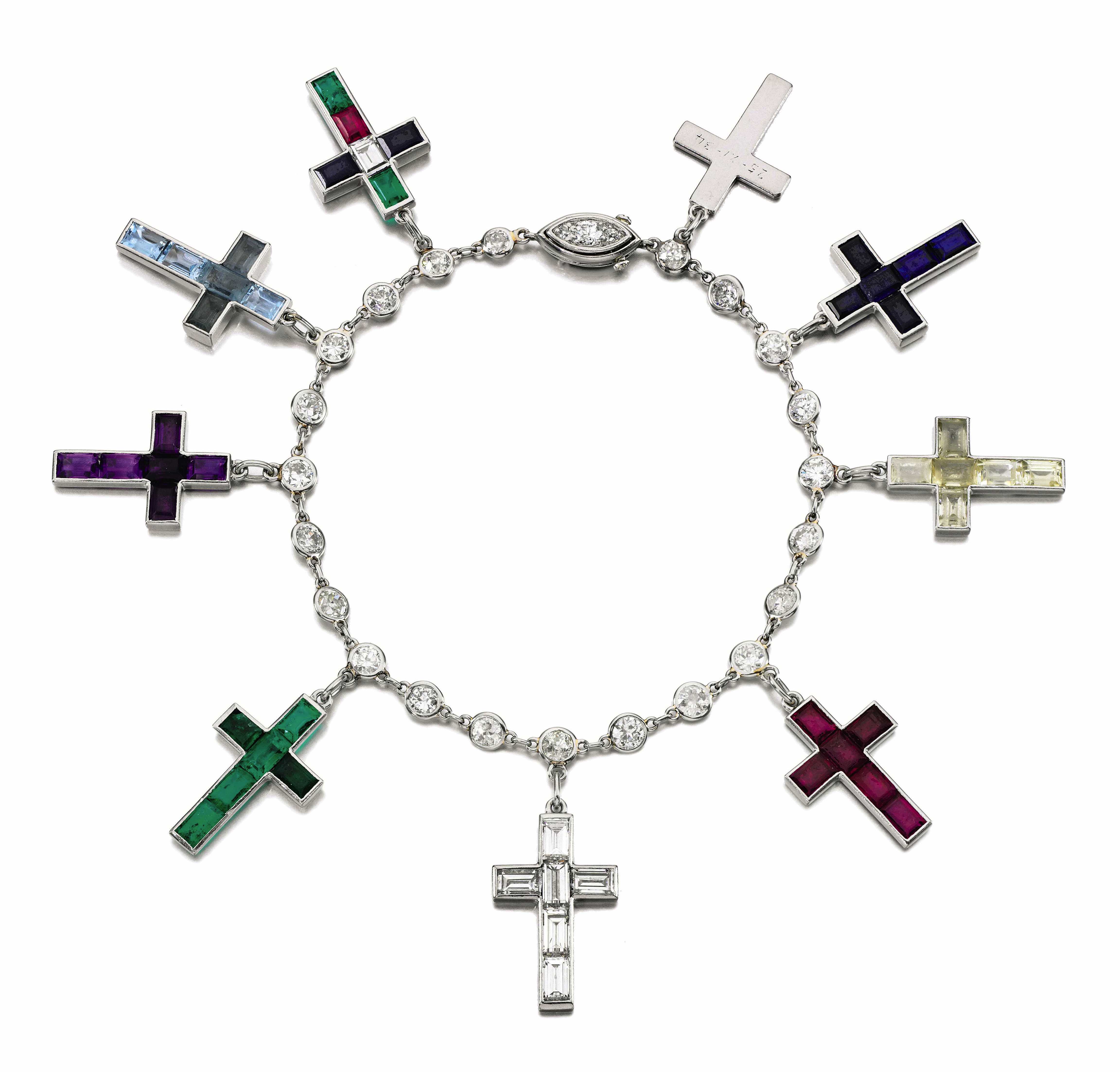 This gold bracelet featuring numerous gems was made by Cartier between 1934 and '44. This gold bracelet featuring numerous gems was made by Cartier between 1934 and '44.