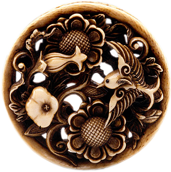 Ishikawa Rensai carved this ivory and inlaid piece depicting lotus blossoms and a bird in the mid-to-late 19th century. Ishikawa Rensai carved this ivory and inlaid piece depicting lotus blossoms and a bird in the mid-to-late 19th century.