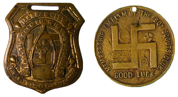 badgencoin 8. On the left, a pre-1920s good-luck watch fob touting the virtues of Kansas City's livestock market. On the right, a pre-Nazi-era membership emblem distributed by the Boy Scouts.