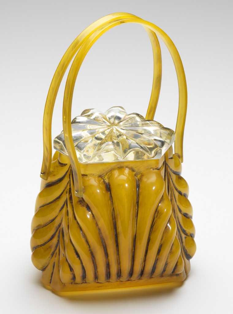 Llewellyn Blond Carved Llewellyn was known for its carved Lucite bags, as well as ones like this one made from shell, a hard plastic material composed of cellulose acetate.