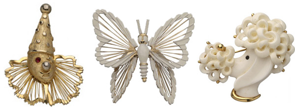 monet-trio2 Monet figural pins include a Spinneret Clown from the early 1960s, an enameled butterfly from the early 1970s, and a resin poodle head, also from the '70s, that's accented in gold.