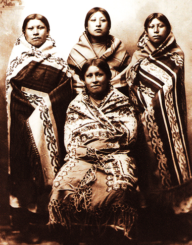 Women in Blankets Four young women wrapped in blankets, circa 1890. From "Language of the Robe," courtesy of Western History Collections, University of Oklahoma library.