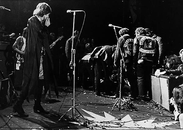 Mick Jagger Mick Jagger of the Rolling Stones looks on while his Hells Angels security force practices crowd control at Altamont, 1969.