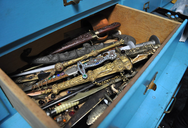 drawer-o-daggers Open one of the turquoise blue drawers at the Joseff studio, and you might find bejeweled daggers.