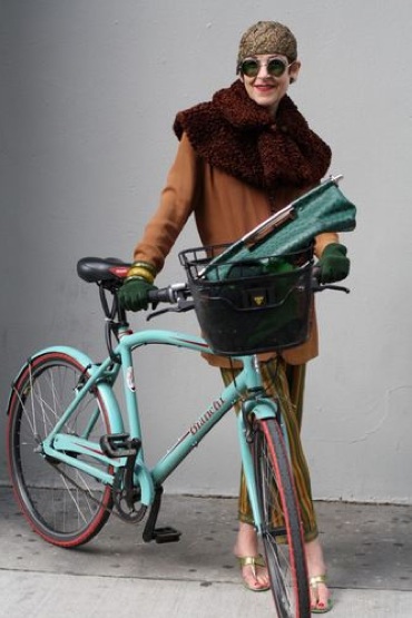 tziporah_9 Salamon has 12 pairs of striped, tapered men's pajama bottoms from the 1940s. She's also wearing a Persian lamb collar, apple juice Bakelite bangles, 1920s hat and glasses, and 1950s sandals. Her green Prada ostrich handbag is one of less than a dozen made.
