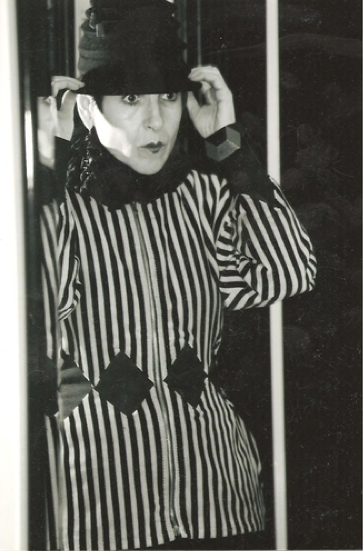 tziporah_12 Salamon turns a Gaultier jacket and an accordion hat into a Pierrot silent film look. The red diamonds in the cuff bracelet echo the jacket.