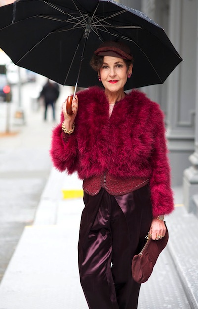 tziporah_2 At top, Tziporah Salmon pairs a red antique Catholic priest's chasuble with a red vintage hat from Tibet. Above, she heads to a meeting in a 1930s jacket under an ostrich-feather coat with Haider Ackerman pants. Photo by Ari Seth Cohen, from Advanced Style.