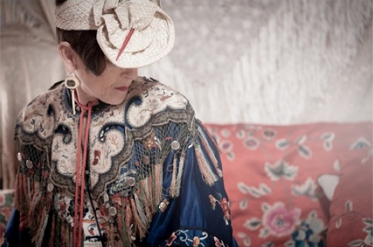 tziporah_3 Salamon wears a tasseled cloud collar from the Qing Dynasty over a 1930s Chinese coat with a 1920s straw hat and earrings made of antique ivory Chinese game pieces. Photo by Martin Scott Powell, martinscottpowell.com