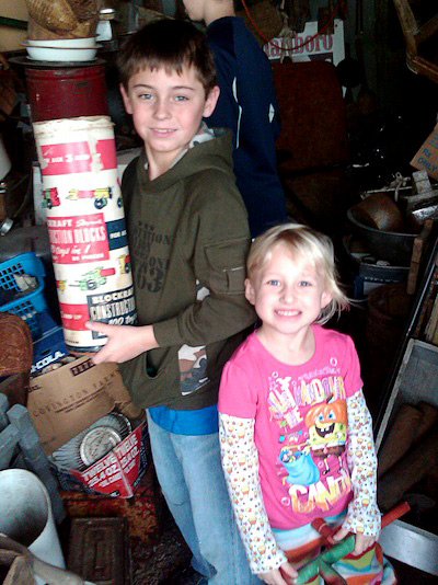 boygirl Nine-year-old Jacob Dick, with his 4-year-old sister, Aubrie, finds a container of Blockraft construction blocks.