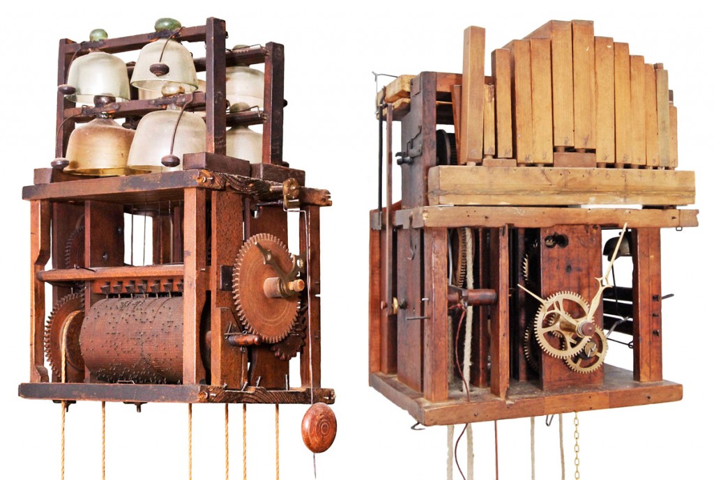 glass bell and wooden flute clocks Early bell and flute clocks with their lacquered shields removed, showing a pinned cylinder and glass bells, circa 1780 (left), and the fifteen wooden pipes used to play four different tunes, circa 1820 (right).