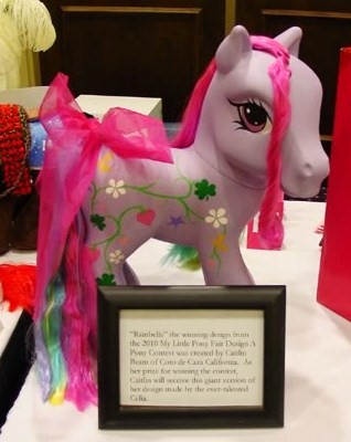 rainbelle_fixed Rainbelle, a custom Pony seen at the My Little Pony Fair. A fan repainted her and rerooted her hair.