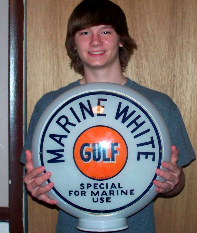 robert At top, 13-year-old James Dick shows his first pick, an electric pinball machine. Above, Robert Brickles, 17, holds a rare Gulf gasoline-pump globe meant for a boat-dock fueling station.