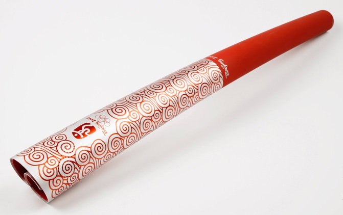 oly_beijing While sleek and modern, the 2008 Beijing torch pays homage to Chinese heritage with its scroll shape and "lucky cloud" pattern. Copyright International Olympic Committee.