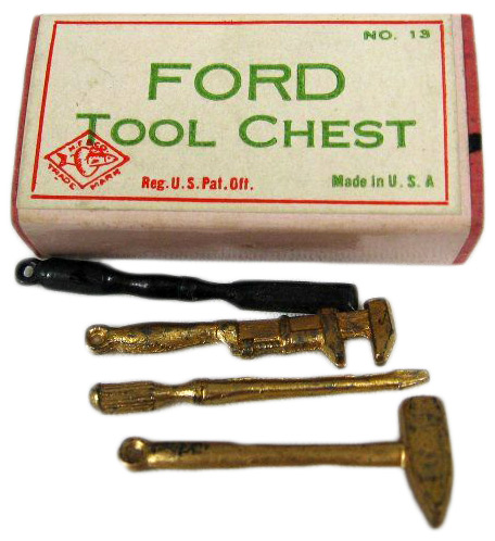 Auto This tiny gag box contained the same charms used in Cracker Jack boxes and Monopoly board games. They could be worn on charm bracelets.