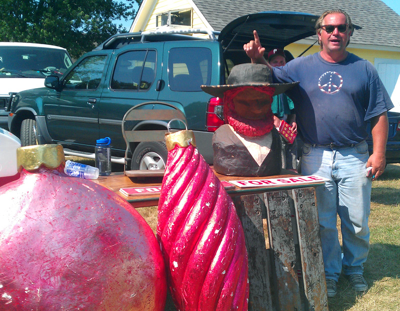 vintage_doctor John Strowsky, known as "The Vintage Doctor," is also not Curt Avery. At a July Brimfield, he offered giant Christmas ornaments and an Amish figure. Photo by Maureen Stanton.