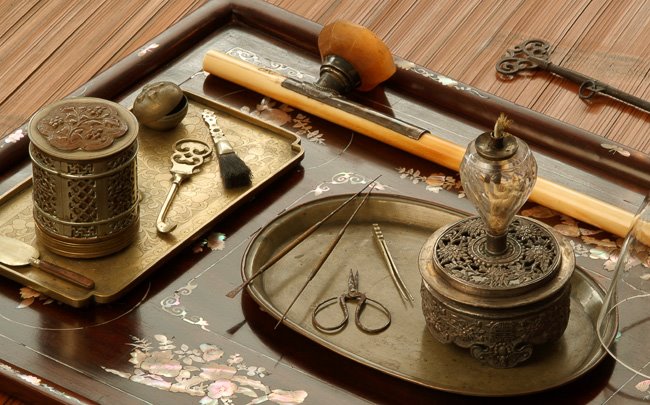 opium spread Opium smoking layout including a solid ivory opium pipe.