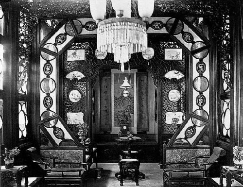 flower boat A luxurious and ornately decorated opium smoking room, possibly inside one of the "flower boat" that could be hired for a night of opium smoking on the Pearl River. The opium bed is at the back of the room. Circa 1880.