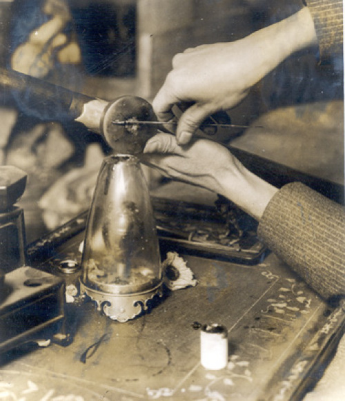NYC_den A rare close-up photograph of an opium smoker preparing a "pill" of opium for the pipe. The photo is said to have been taken in New York City in the 1920s.