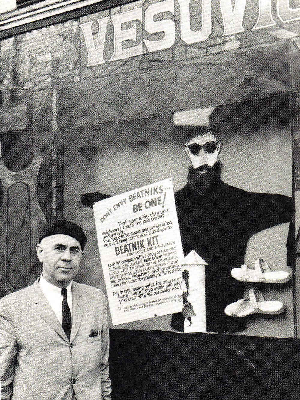 beatnik_kit Henri Lenoir, Cafe Vesuvio's owner, stands in front of their window with a tongue-in-cheek ad for a "Beatnik Kit."
